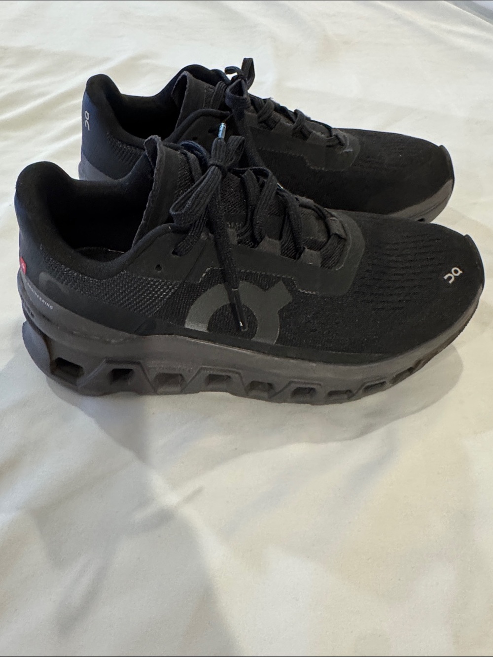 On Women's Cloudmonster Void in a triple-black colorway W8